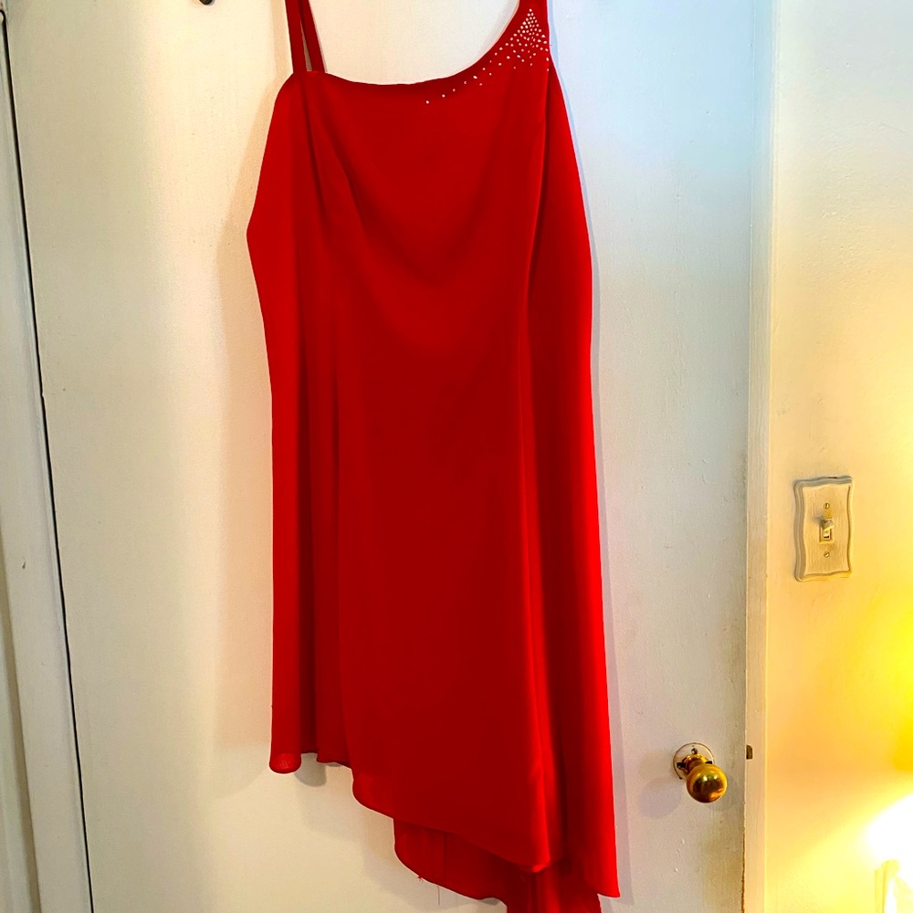 Red Dress with “diamond” detail on shoulder and asymmetrical bottom. Size 10